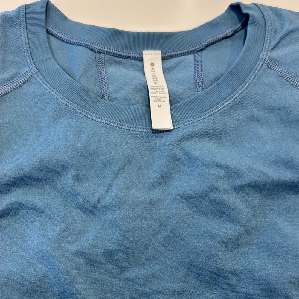 Athleta Momentum Tee in size Medium. Gently worn, good condition.